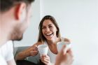 AdobeStock_208131995@bnenin_Laughing couple drinking coffee in the morning